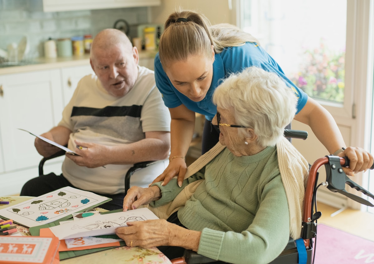 Caregiver leading a companionship activity with older adults