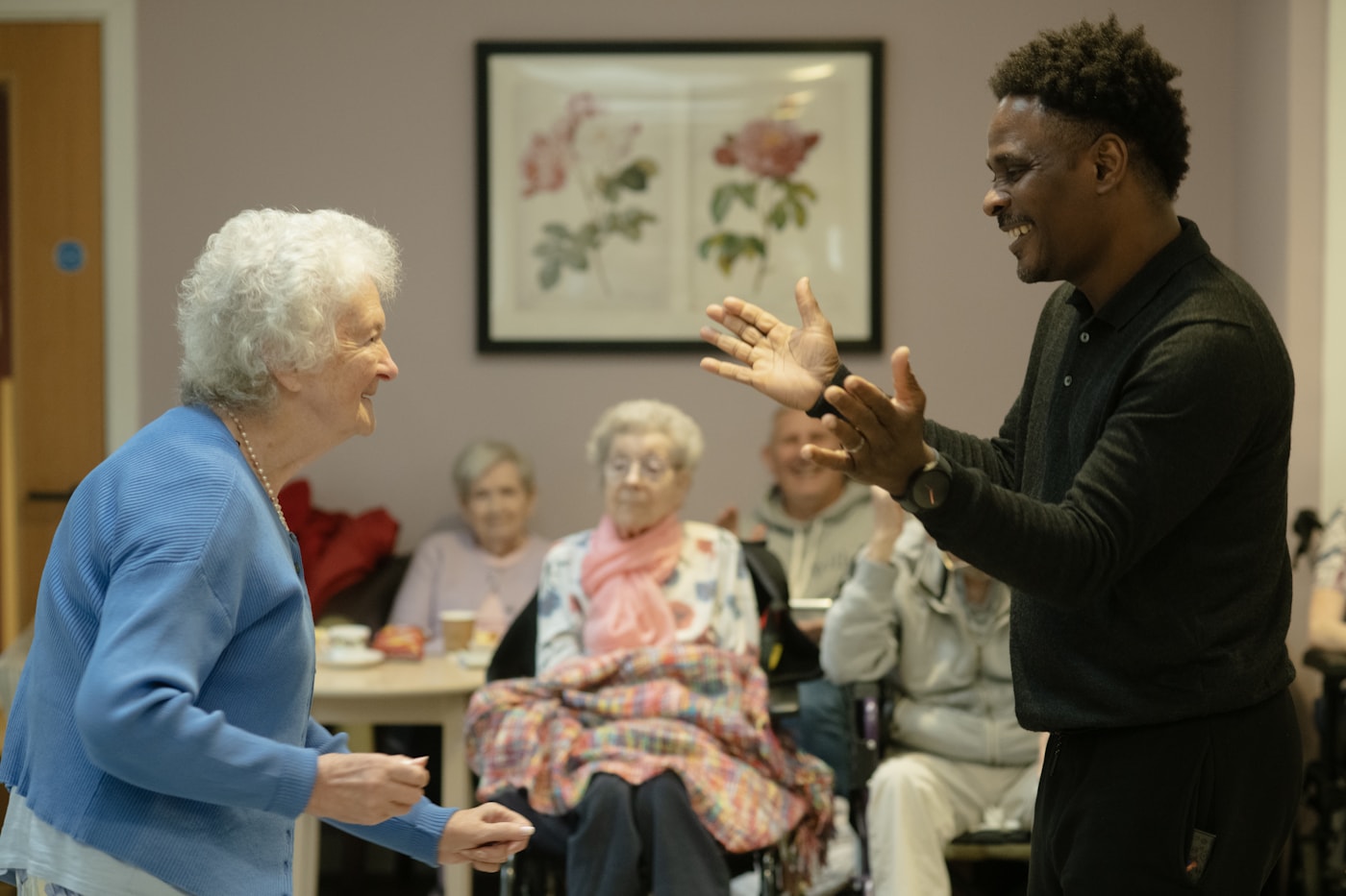 Caregiver providing warm home care support in a comfortable living room